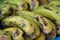 close up photo of a bunch of ripe bananas being served.