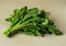 Close up photo of bunch of water cress or garden cress isolated on white background.