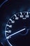 Close up photo of a car\'s speedometer instrument.