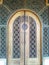 close-up photo of the carved artwork used as a door to the mosque building, it& x27;s really beautiful with a typical dark brown