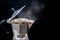 close-up photo of coffee pot Italian Moka coffee pot Moka pot with coffee brewing isolated on a black background