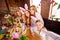 Close up photo company foxy three small girls children day easter two mommy pretty table full handmade craft big wooden