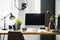 Close-up photo of computer with mockup standing on a wooden desk