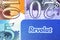 Close up photo of the corner of Revolut bank card with 5, 10, 20 new polymer pound notes. Editorial illustrative. Stone,