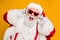 Close up photo of crazy funny santa claus listen music on modern headset celebrate christmas time noel party wear red