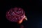 Close up photo of cut pomegranate in dark background