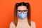 Close up photo of cute charming nice pretty cheerful lady have breathing mask stay home protect from covid-19 infection