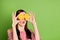 Close up photo of cute pretty playful student girl hold two oranges spectacles shocked imagine watching movie wear