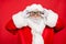 Close up photo of focused funky cool santa claus fix his goggles before rocket flight wear white gloves cap 