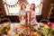 Close up photo foxy three small girls children day two mommy pretty table full handmade craft big wooden have good great