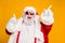Close up photo of funky funny fat crazy santa claus celebrate x-mas party wear headset sing listen music raise fingers