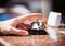 Close up photo of hand ringing a hotel reception service bell