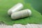 Close up photo of herbal capsule from organic herb for health care using. alternative multivitamins for good living life healthy