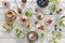 Close-up photo of homemade cakes with mascarpone cheese, cinnamon, strawberries, blueberries and beautiful wild apple tree floweri