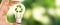 Close up photo of lightbulb with recycle icon with nature background as a symbol of reduce, reuse and recycle of resources.