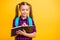 Close up photo of little lady diligent pupil noting teacher words notepad wear casual checkered shirt isolated yellow