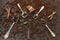 Close-up photo of metal spoons with aroma coffee beans and fresh