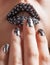Close-up photo of metallic lips and Minx nails