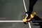 Close up photo of modern man in stylish wear keeping feet on yellow skateboard