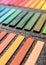 Close-up photo of new colorful chalk pastels in box