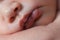 Close up photo of newborn baby lips.