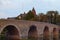 Close-up photo of Old Lanh Bridge in Wetzlar. City park and The Wetzlar Cathedral at the background. Autumn landscape photo.