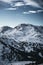 Close up photo of one of nocky mountains covered in snow in Austria.