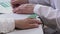 Close up photo of oxygen pressure measurement. Female hands of a doctor and patient. Doctor uses a pulse oximeter to