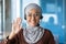 Close-up photo portrait of young beautiful Muslim business woman, tech support worker in hijab and glasses, customer