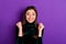 Close up photo of pretty crazy youth raising her fists with toothy smile isolated over purple violet background