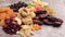 Close up photo of raw nuts and dried fruits