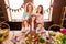 Close up photo red hair three little girls children day two mommy pretty table full handmade craft big wooden have good