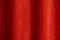 Close up photo of Red velvet curtain with curves hung on the