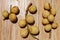 close up photo of ripe duku fruit with a wooden background.