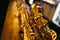 Close up photo of a shiny golden saxophone. Vintage Saxophone.