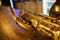 Close up photo of a shiny golden saxophone. Vintage Saxophone.