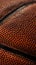 Close-up photo of a smooth leather basketball filling the entire frame  sports photography.