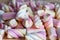 Close-up photo of some sweets, showing the sugar texture of various colored jellies that melt in your mouth