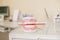 Close up photo of teeth model denture with red tooth brush