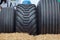 Close up photo of three heavy tractor wheel tire of construction or agriculture automotive equipment