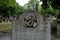 Close up photo of tombstone at the historic Jewish cemetery at Brady Street, Whitechapel, East London. Photo shows lyre or harp