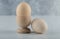 Close up photo Two fresh eggs in eggcup and ground on white background