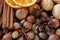 Close up photo of walnuts, hazelnuts, cinnamon barks