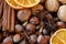 Close up photo of walnuts, hazelnuts, cinnamon barks,