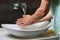 Close up photo of washing doctors hands under running water for protection of pandemic of coronovirus covid 19.