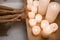 Close up photo of woman& x27;s body in spa bathtub with wooden table vase of plant candle. Modern spa center