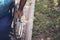 Close up photo of Young disabled man holding wheelchair outside