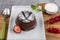 Close up Photograph of a chocolate souffle. Chocolate fondant lava cake with strawberries