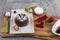 Close up Photograph of a chocolate souffle. Chocolate fondant lava cake with strawberries