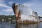 Close-up photograph from the water of a concrete ship that is part of the Powell River breakwater in British Columbia, Canada